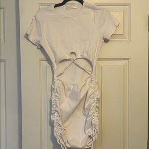 women's white dress with cutout of torso and cinched at the hips to the thighs